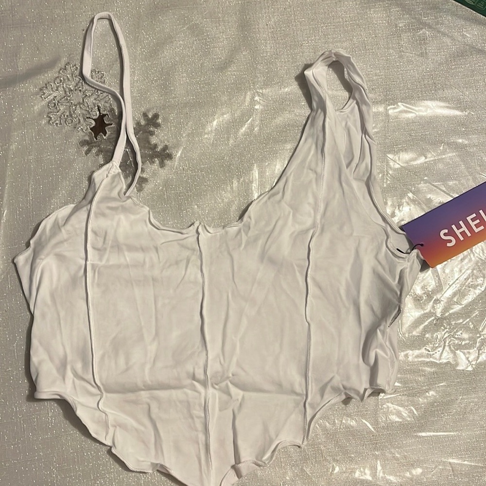 I am selling a shirt, brand is SHEIN, Color is white, Size is small.